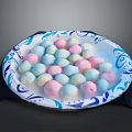 Colorful Marshmallows Arranged in Blue and White Patterned Plate on Dark Surface