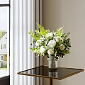 Fresh White Flowers In Stylish Glass Vase With Green Foliage On Black Table By Window