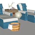 Two Blue And White Massage Beds With Small Table Decorative Wooden Buckets On White Background