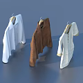 Three Different Style Tops Hanging On Hangers In White And Brown Colors