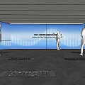 Modern Exhibition Hall With Large Screen Polished Floor Ceiling Light Strips And Visitors