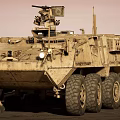 Military Utility Vehicle With Desert Camouflage Multi Wheeled Design Roof Mounted Weapons And Sensors