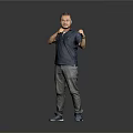 Man In Dark Blue Shirt Gray Pants Posing With Boxing Gestures On Gray Background