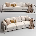 Light Colored Three Seater Sofa with Decorative Pillows and Cozy Blanket 3d model