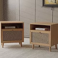 Two Modern Wooden Bedside Tables With Rattan Doors And Books On Top
