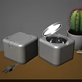 White Square Medical Devices With Open Lid And Black Interior On Wooden Tabletop