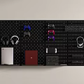 Entertainment Electronics Pegboard Storage Display Featuring Game Controllers Headphones Console And Red Notebook 3d model
