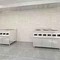 Commercial Stainless Steel Kitchen Appliances With Multiple Burners Control Panels Tile Walls And Marble Flooring