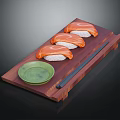 Fresh Salmon Sushi on Wooden Serving Board with Green Soy Sauce Dish and Chopsticks