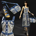 Elegant Model Wearing Blue And White Patterned Dress With Matching Handbag