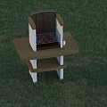 Outdoor Fire Pit With Brown Countertop And Shelf On Green Grass
