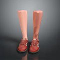 Red Sports Shoes Worn On Flesh Colored Prosthetic Legs Against Dark Background