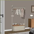 Standing Clothes Rack with Hanging Coats and Woven Storage Shelf in Cozy Home Bedroom