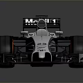 Aerodynamic McLaren Formula 1 Racing Car With Silver Body Black Accents And Red Wheel Rims