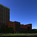 School Campus Buildings Including High Rise Teaching Tower Athletic Stadium And Green Surrounding Trees