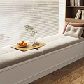 Cozy Bay Window Seat with Light Gray Cushion Pillows Wooden Tray Oranges Book and Plant