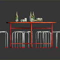 Red Round Table With Wine Bottles Cups And White Metal Leg Stools