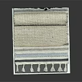Woven Rugs With Tassels Stacked And Rolled In Beige And Blue Stripes