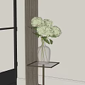 Clear Glass Vase With White Hydrangea Flowers On Metal Table Near Window