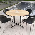 Round Wooden Outdoor Table with Black Chairs Glass Vase on Wooden Deck by Pool