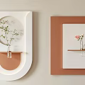 Modern Geometric Wall Decor with White Brown Frames and Green Pink Flowers on Shelves