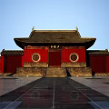 Ancient Chinese Architecture With Red Walls Circular Windows Traditional Roof And Stone Steps