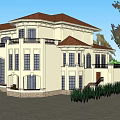 Two Story Classical Hotel Building With Red Roof White Exterior Balcony And Green Plants