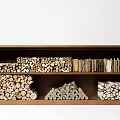 Organized Shelf With Stacked Firewood And Piled Stones For Storage