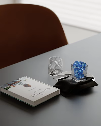 Decorative Ornament Set With Book Glass Cup Blue Decorative Pieces On Black Cloth Gray Table 3d model