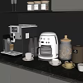 Modern Kitchen Black Marble Countertop With Coffee Machine Blender Jars Cups And Cabinets