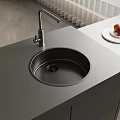 Round Kitchen Sink in Modern Gray Countertop with Stainless Steel Faucet and Fruit on Plate