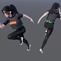 A Woman in Black Sportswear With Orange and Green Accents in Dynamic Running Pose