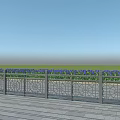 Metal Decorative Fence with Intricate Patterns on Wooden Deck with Green Grass and Blue Sky