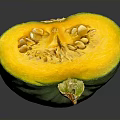 Fresh Sliced Pumpkin With Green Skin Showing Yellow Flesh And Seeds On Gray Surface