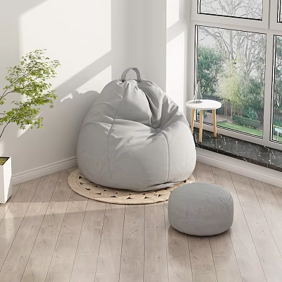 Cozy Gray Bean Bag Chair With Ottoman By Window On Wooden Floor With Green Plant 3d model