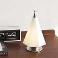 Cone Shaped Table Lamp With White Shade Metal Base And Flip Clock On Wooden Tabletop
