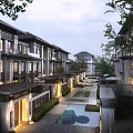 Modern Townhouse Exterior With Landscaped Courtyard Pathway Greenery And Water Feature