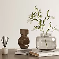 Decorative Ornament Combination With Reed Diffuser Brown Ceramic Clear Glass Vases Greenery And Stacked Books