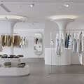Modern Minimalist Clothing Store Interior With Hanging Apparel And Display Racks