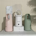 Pastel Pink White And Green Daily Use Humidifiers On Marble Countertop With Striped Wall