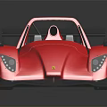 Red Open Top Racing Car With Aerodynamic Rear Wing And Streamlined Body