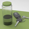 Transparent Glass Jar With Green Lid And Liquid Next To Car Keys