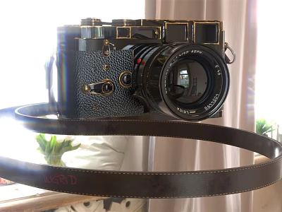Vintage Black Digital Camera With Gold Accents And Leather Strap 3d model