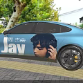 Blue Car With Jay Chou Image And JAY Text In Outdoor Setting With Trees