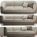 Modern Three Seater Sofa With Light Beige Upholstery And Brown Decorative Pillows
