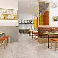 Bright Restaurant Interior Featuring Wooden Tables Orange Stools Booth Seating And Colorful Wall Art