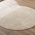 Modern Beige Plush Round Rug With Soft Texture On Wooden Floor