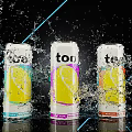 Three Colorful Too Drink Cans With Lemon Design Splashing Water And Blue Light