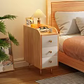 Wooden Nightstand With White Drawers Gold Legs Table Lamp Glasses And Photo Frame
