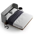 Modern Upholstered Double Bed with Quilted Gray Headboard White Pillows and Wooden Legs